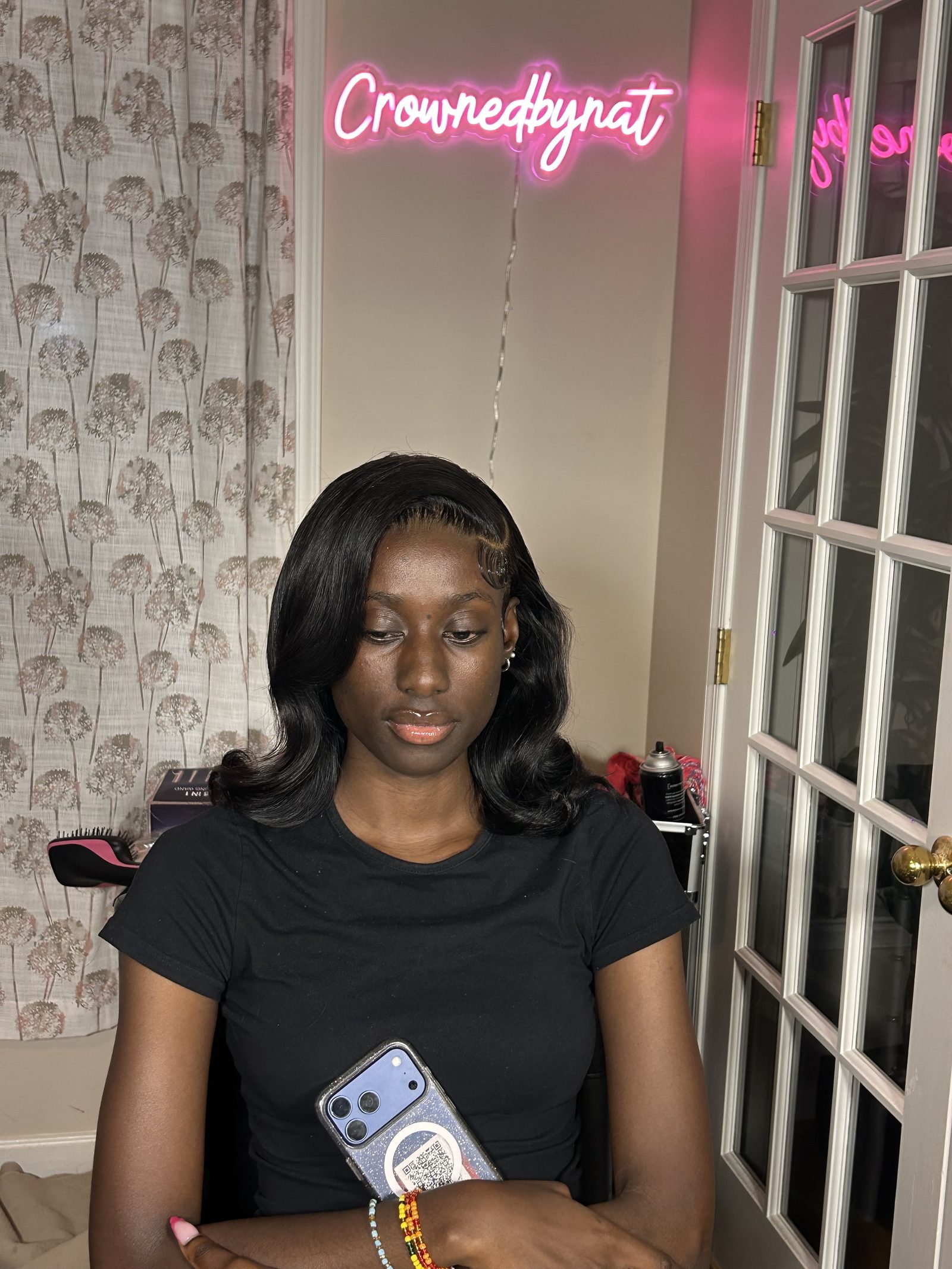 A soft lob curved under at the ends, parted at the side, with the baby hairs laid in fine waves