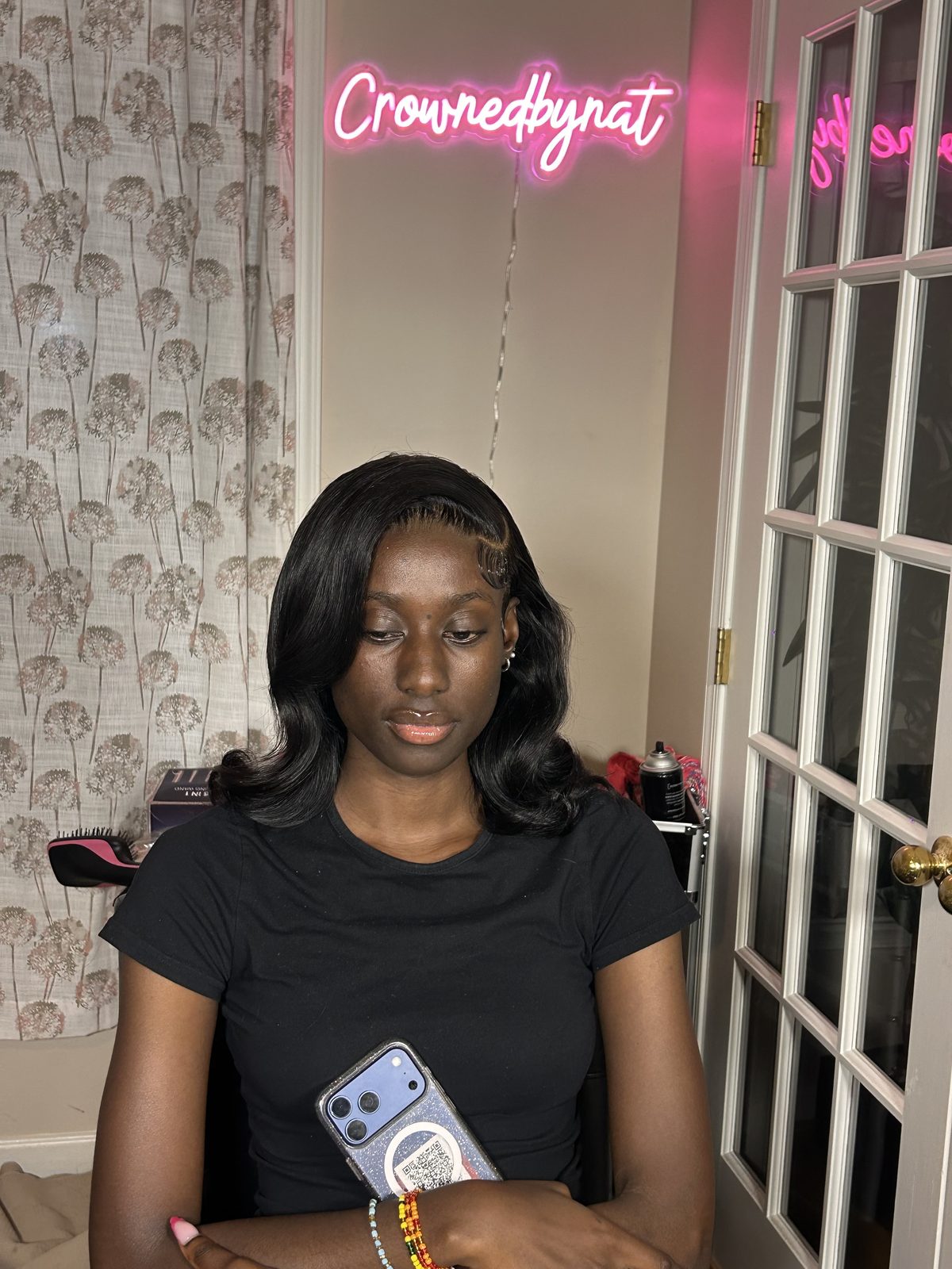 A soft lob curved under at the ends, parted at the side, with the baby hairs laid in fine waves