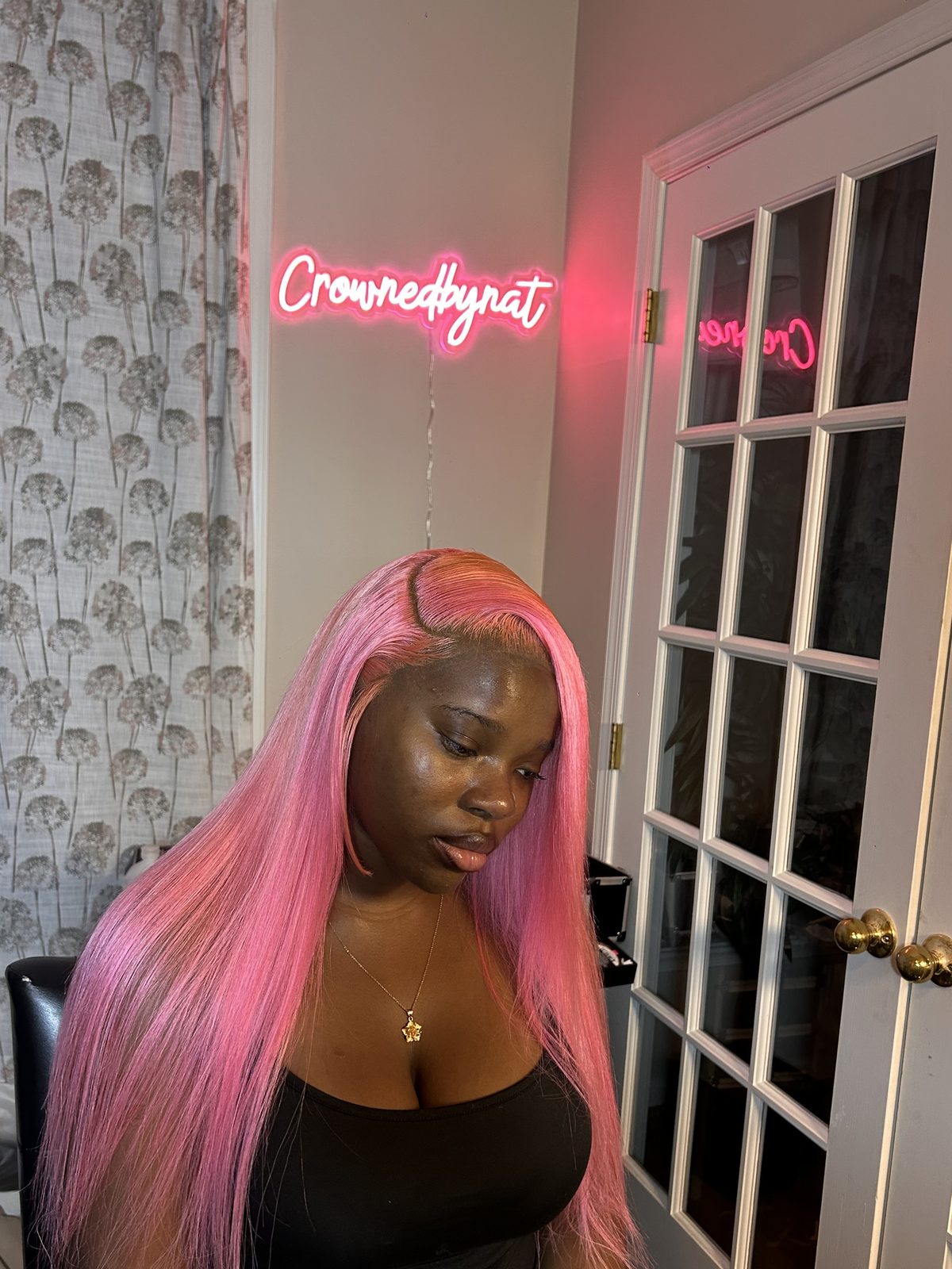 A long straight install in candy pink with a deep side parting, cut to a blunt baseline