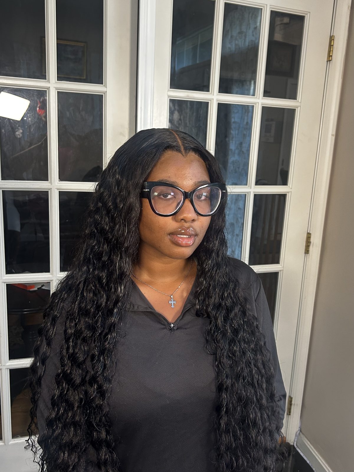 A shoulder-length deep-wave install with a centre parting, the wave pattern loosening from the root down through the ends