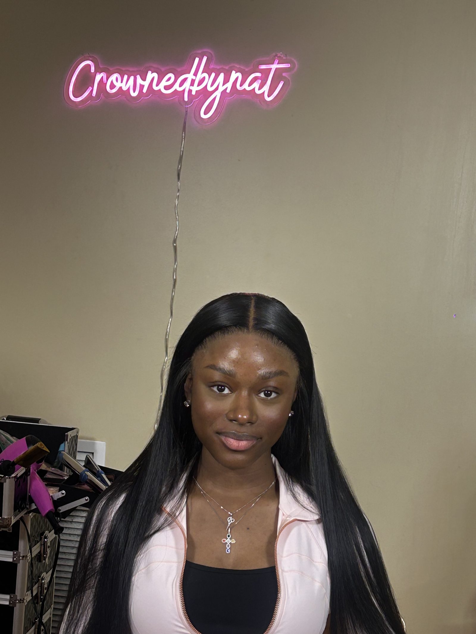 A waist-length straight install with a glass-smooth finish, the centre parting laid flat and the ends kept blunt