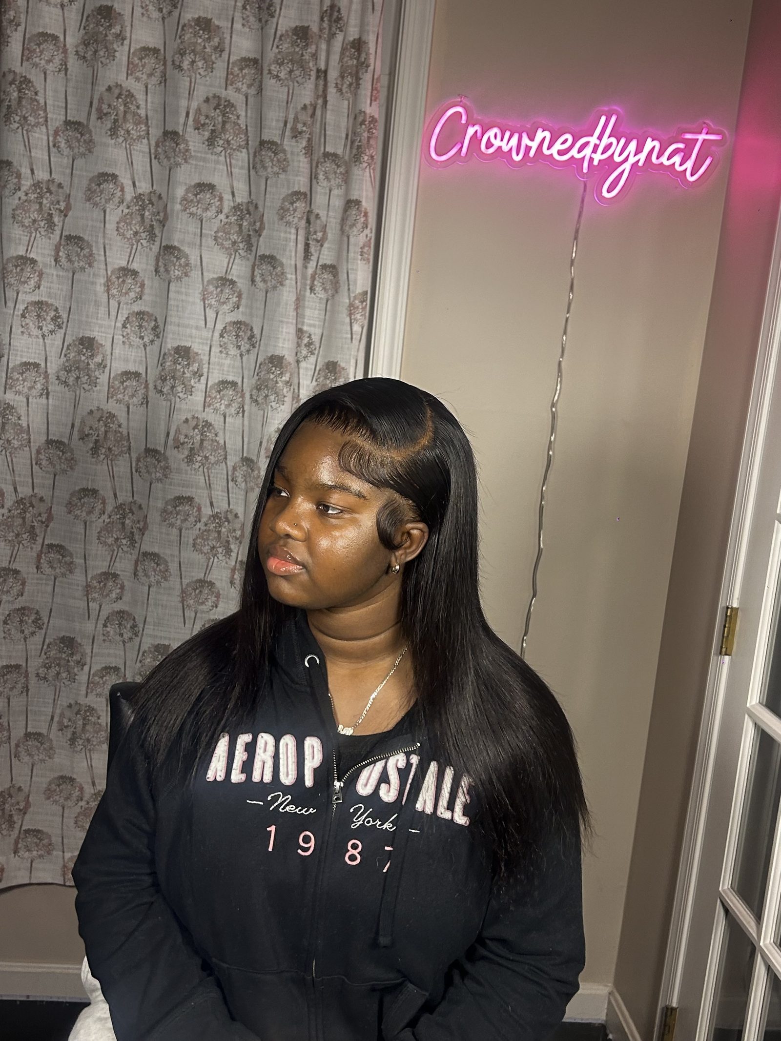A straight install with a deep side parting, one moulded swoop set across the forehead and the edges laid along the hairline